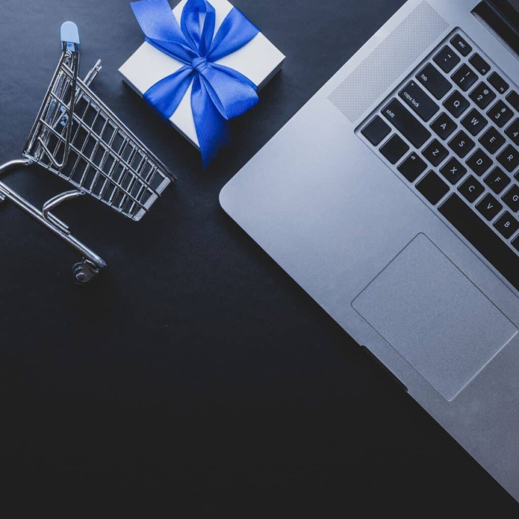 Laptop, gift box, shopping cart flat-rate website design